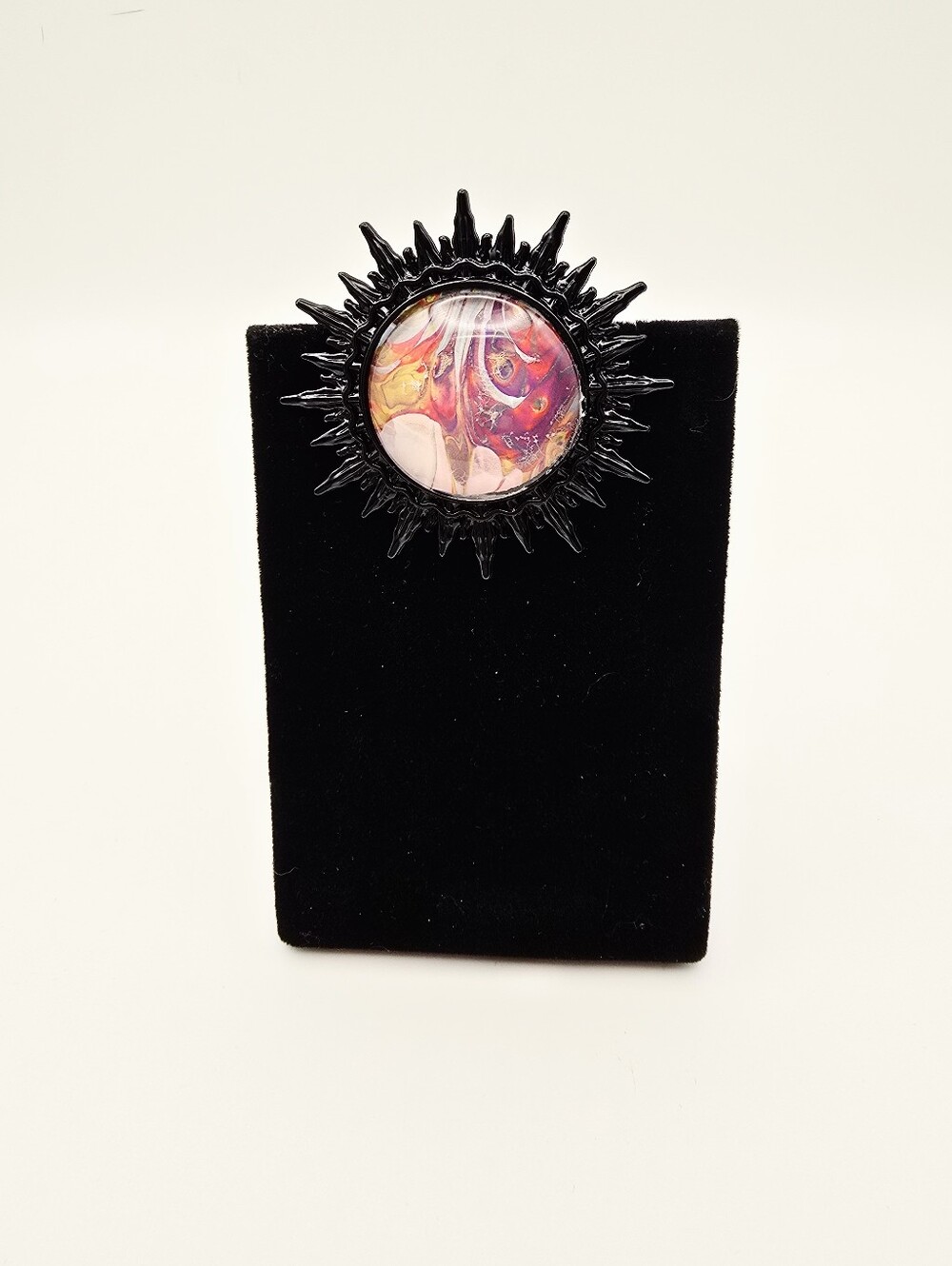 Vibrant Handcrafted Sunburst Pin with Multicolor Center
